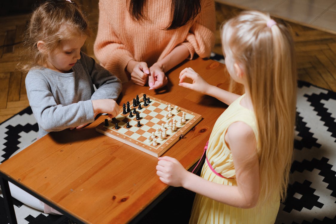Free Girls Playing Chess Together Stock Photo