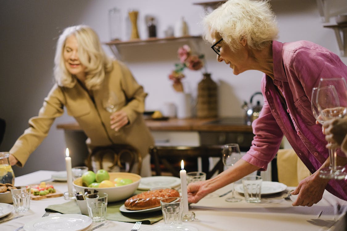 Free Women Preparing Foods on the Table Stock Photo