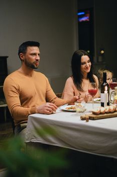 Family enjoying a dinner at home, capturing warmth and togetherness.