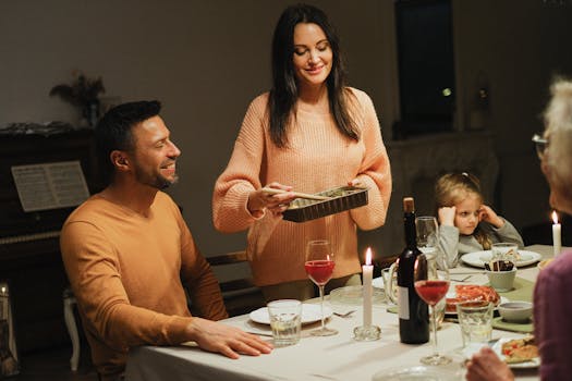 Warm family dinner with candles and wine, perfect for intimate home gatherings.