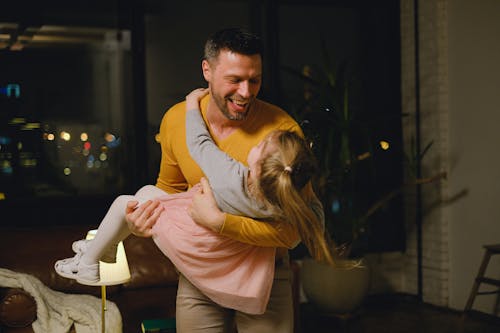 Free Man Playing with his Daughter Stock Photo