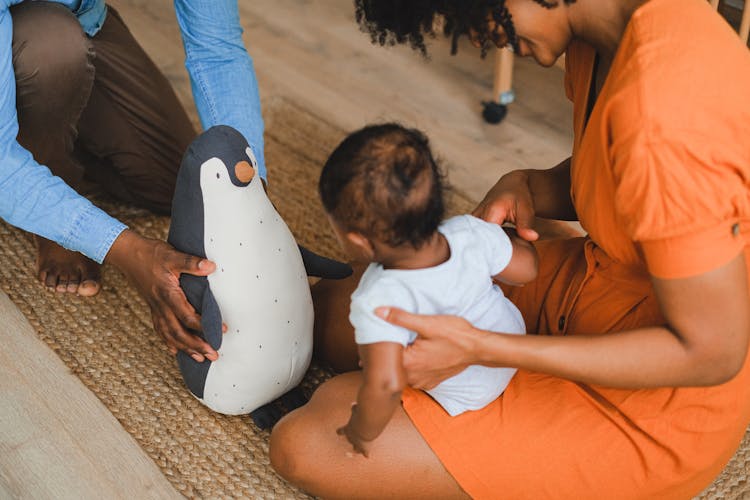 Parents Playing With A Baby