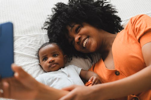 Free Mother Taking Selfie with her Baby Stock Photo