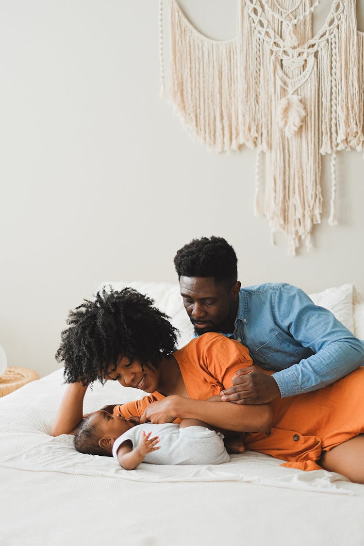 Parents Playing With Their Baby