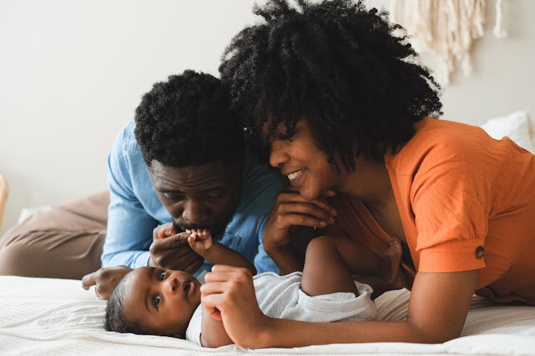 Parents Playing With Their Baby