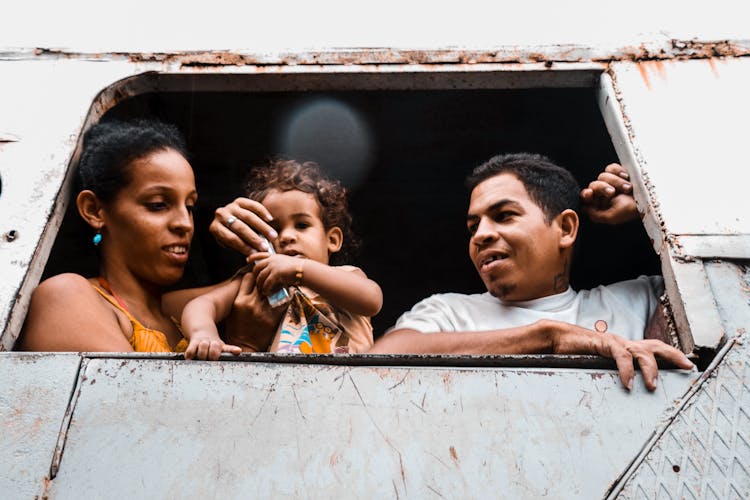 Man Woman And Child At The Window