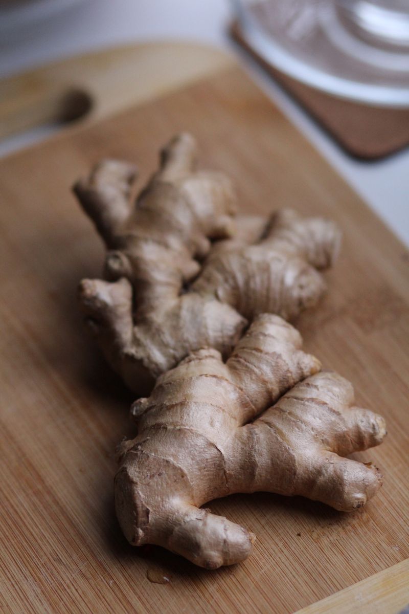 Fresh ginger root on a wooden cutting board