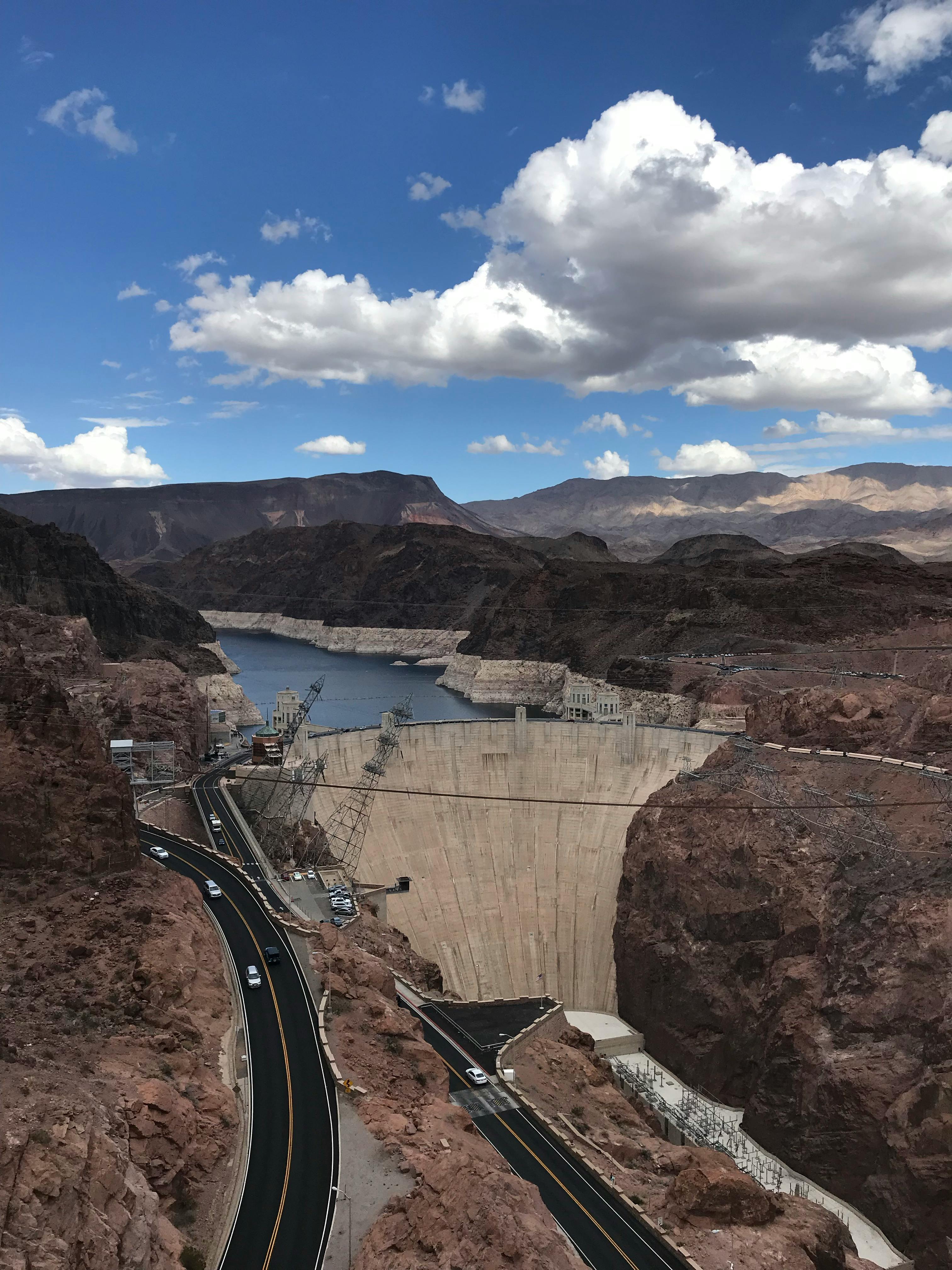 hoover dam under blue sky and white clouds