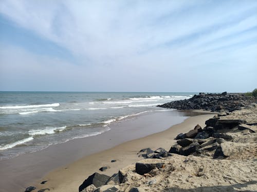 Brown Sand Beach Under Beautiful Sky