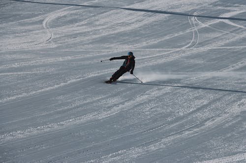 A Man Skiing on Snow