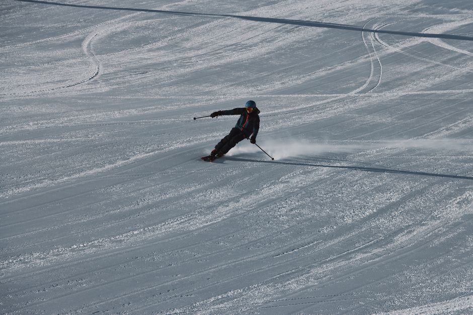 A skier gracefully navigates a snowy slope in Soelden, Austria during winter.