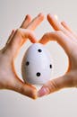 Close-Up Shot of a Person Holding an Easter Egg
