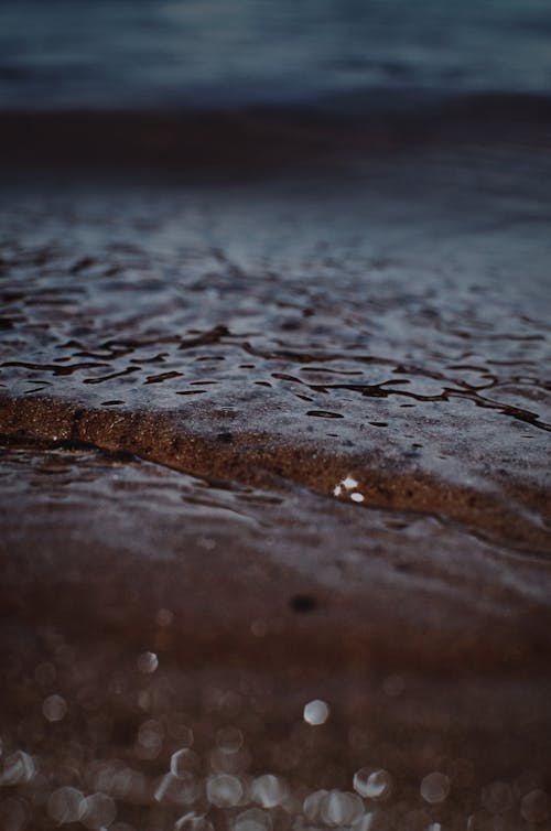 Close-Up Shot of Sand on the Shore