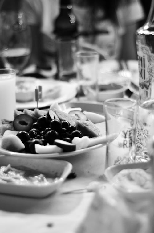 Grayscale Photo of Bowl Full of Fruits 