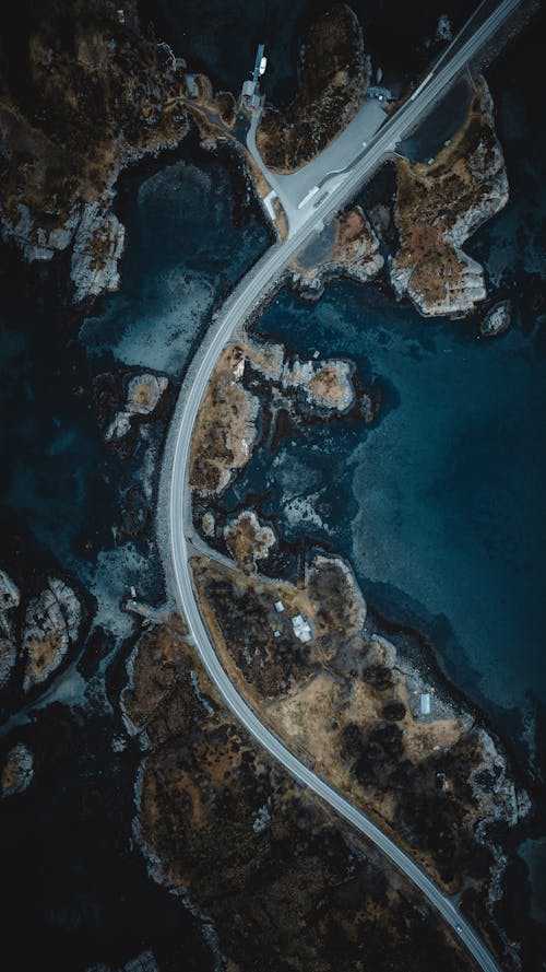 Top View of a Concrete Road near Body of Water