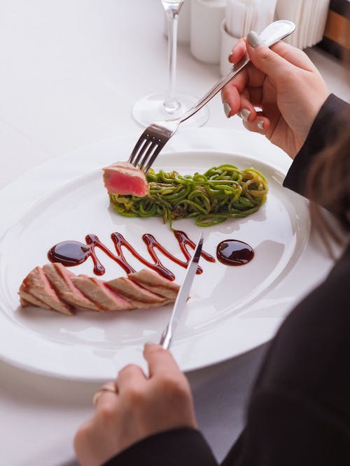 Free Woman Eating Dish with Tuna  Stock Photo