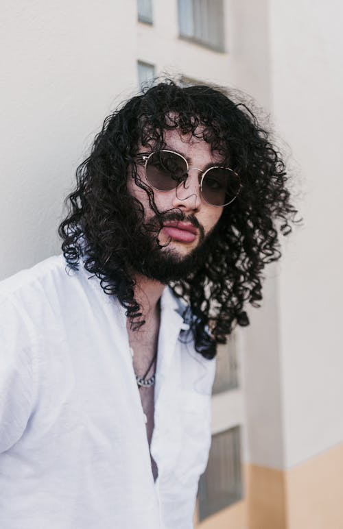Free Man with Long Curly Black Hair and Beard  Stock Photo