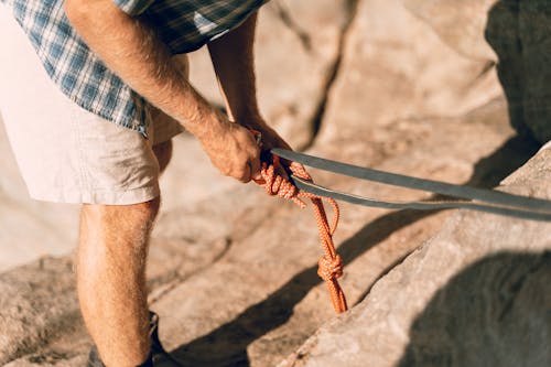 Free Man Holding Belt and Rope Stock Photo