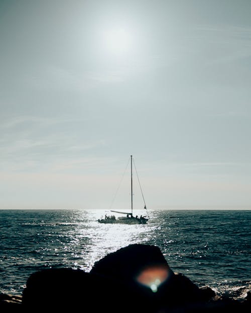 Free Landscape Photography of a Sailboat at Sea Stock Photo