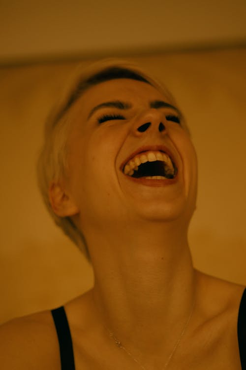 Close Up Photo of Woman Laughing