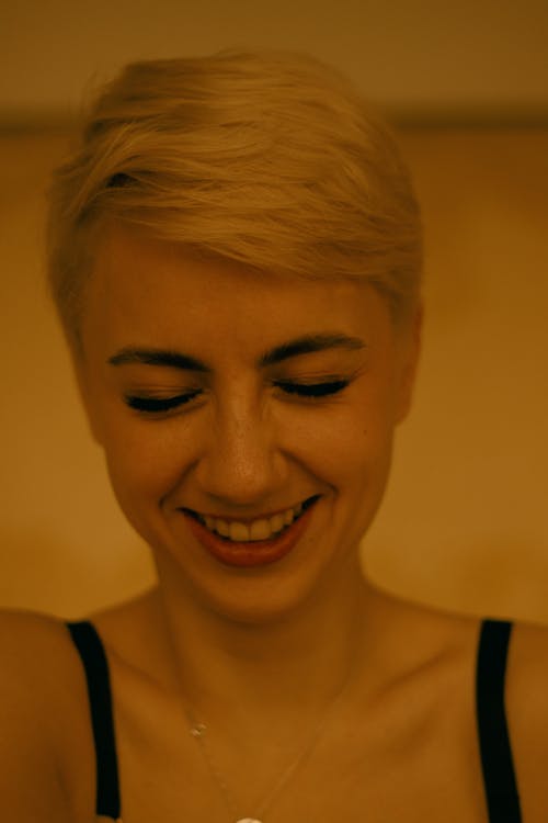 Close Up Photo of Blond Woman Laughing