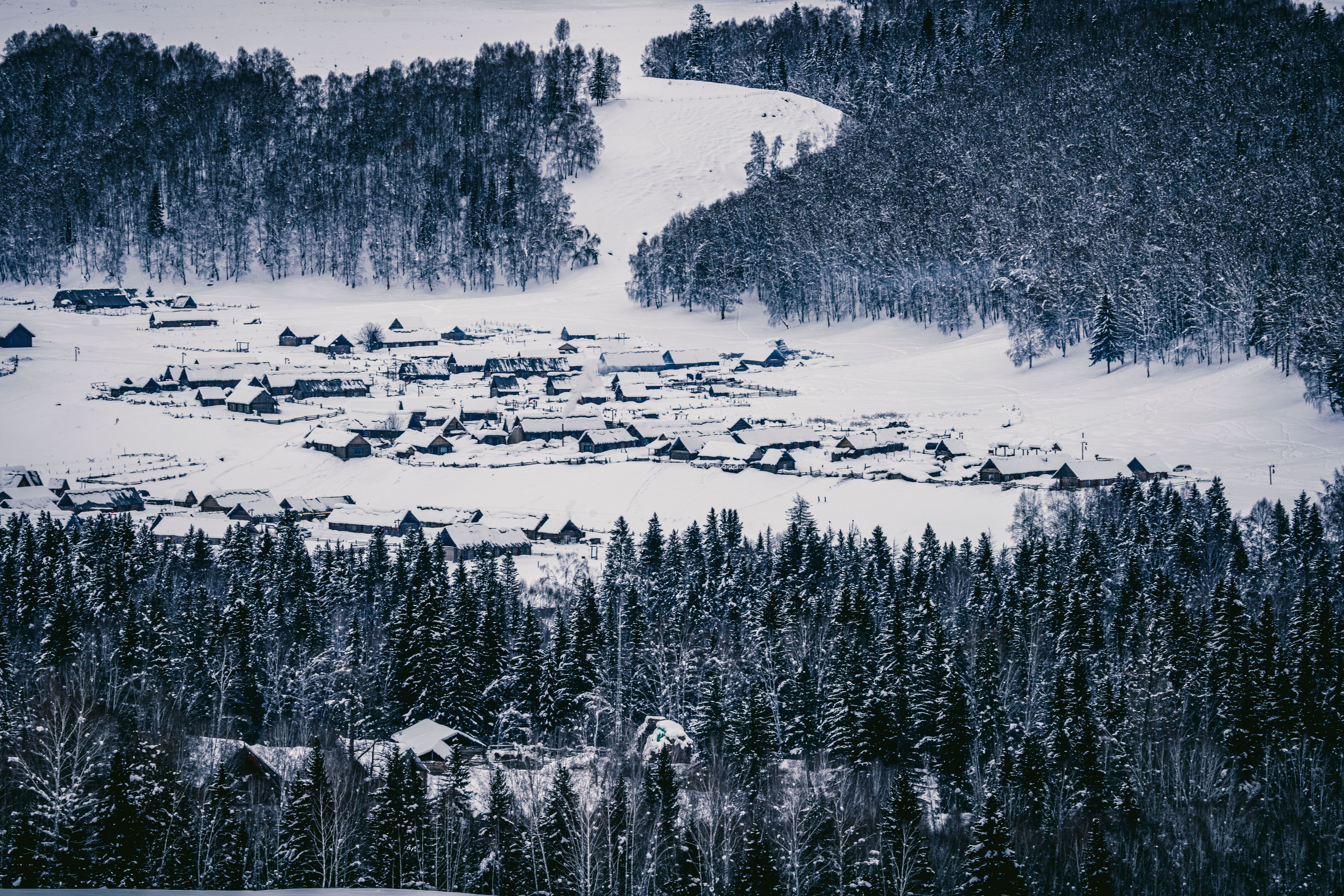 Aerial View of a Mountain Village in Snow · Free Stock Photo