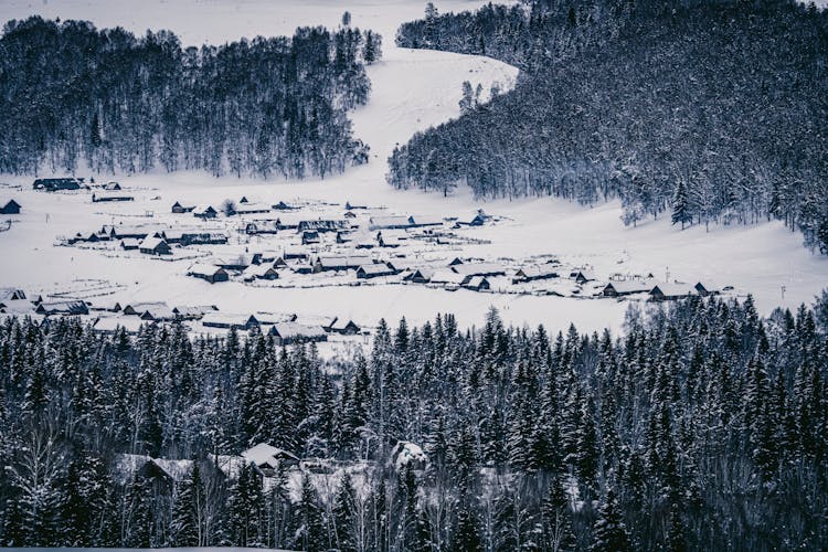 Aerial View Of A Mountain Village In Snow 