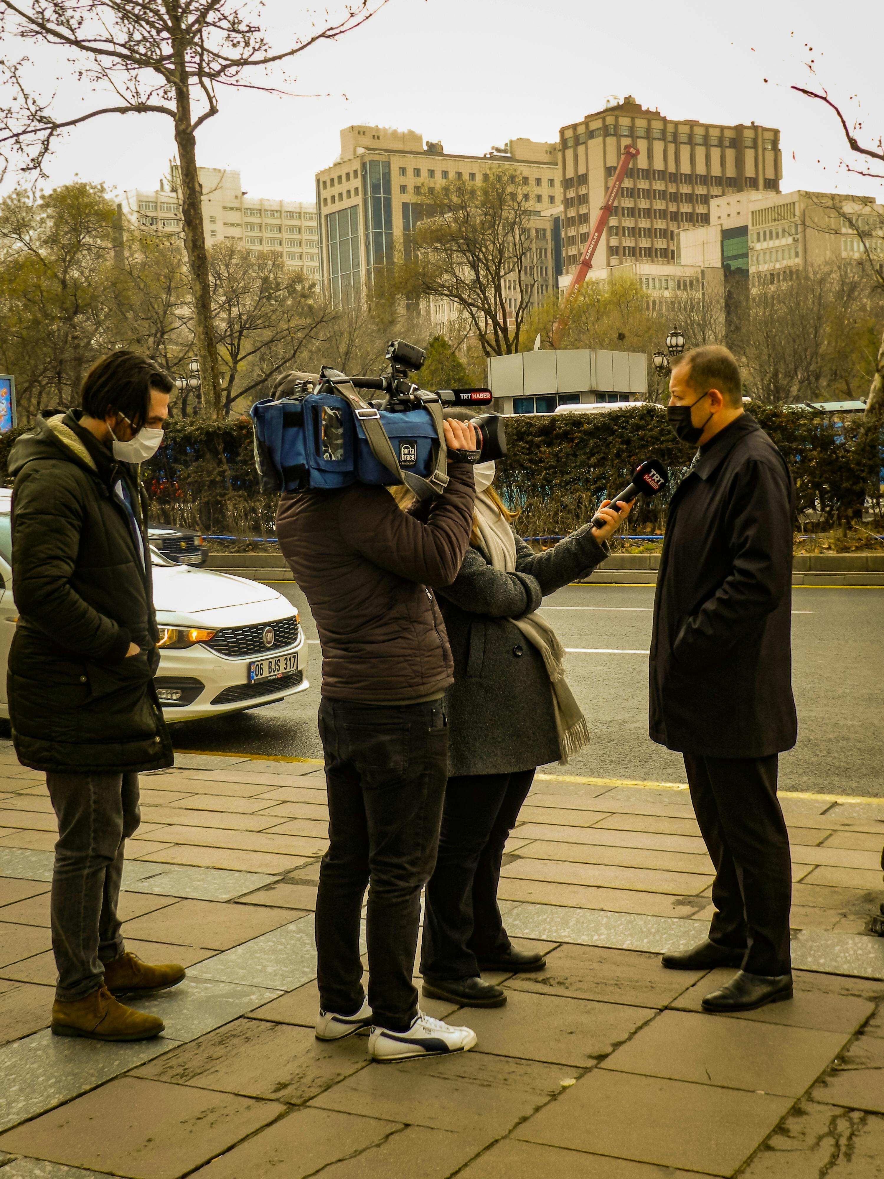 a journalist interviewing a man in a city