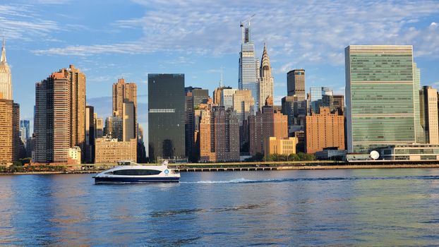 Ferryboat on Water Near City Buildings