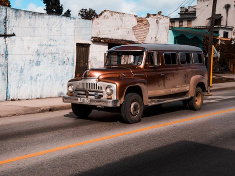 A classic International Harvester van captured on a sunny day, showcasing urban street vibes.