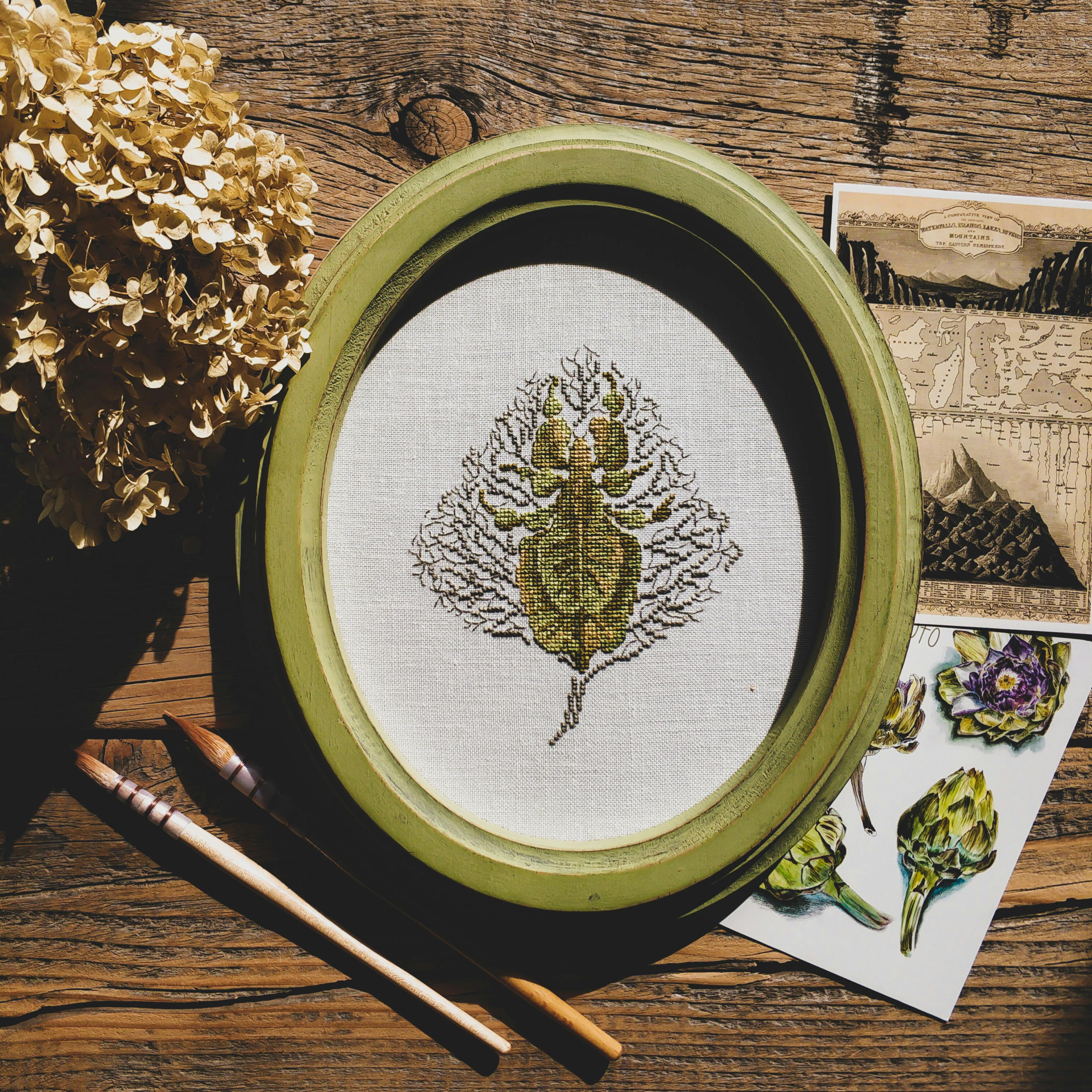 Cross Stitch Project on a Wooden Surface