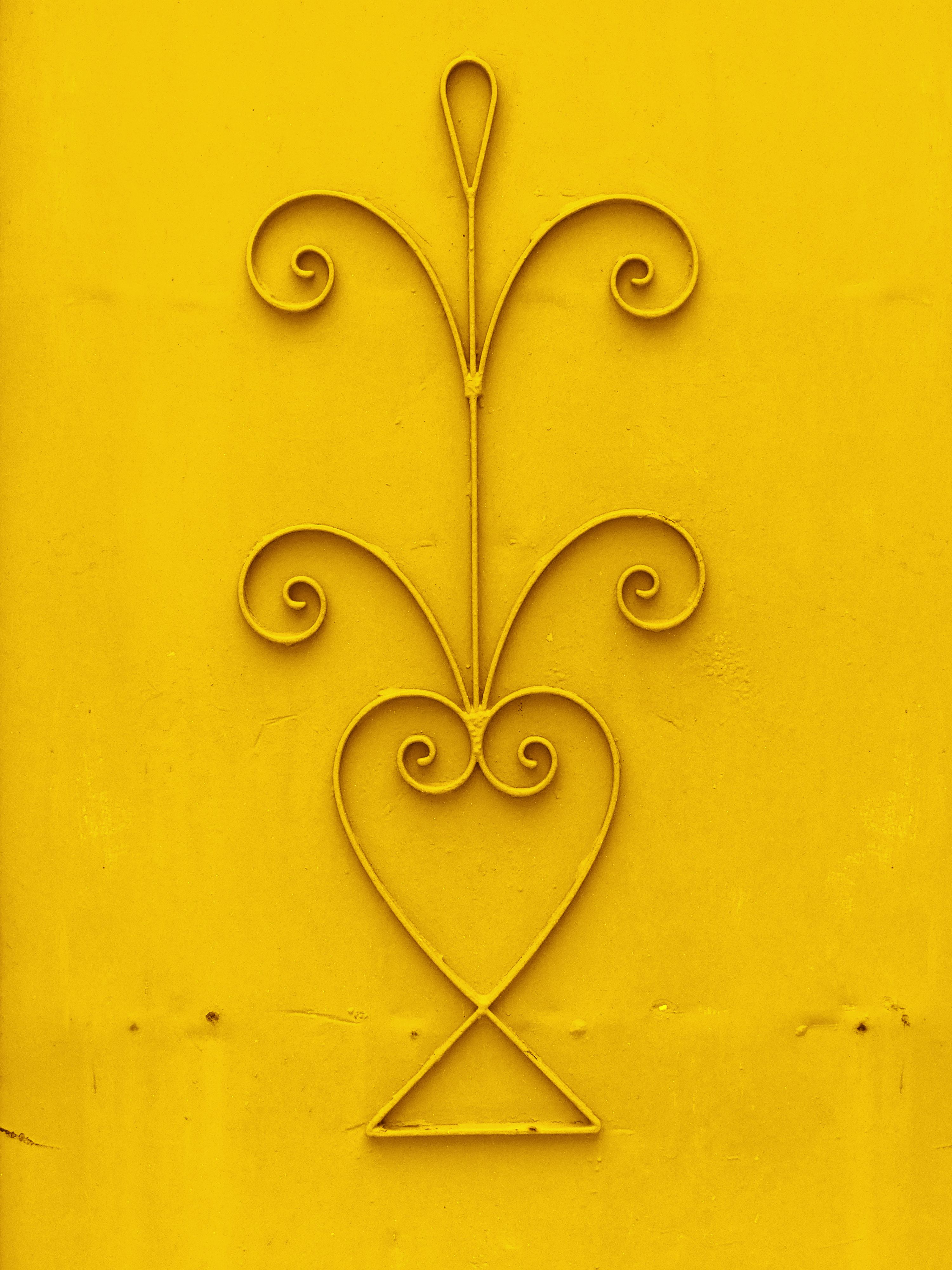 A Pattern on a Yellow Metal Surface · Free Stock Photo