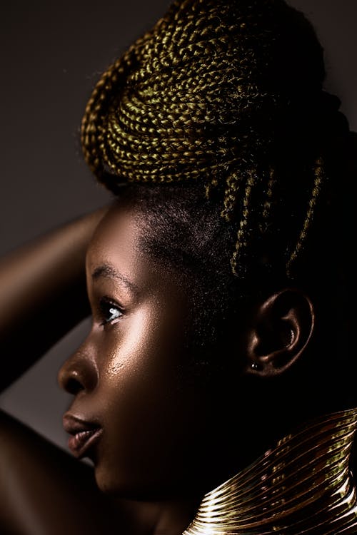 Side Portrait of Young Woman with Braided Hair 