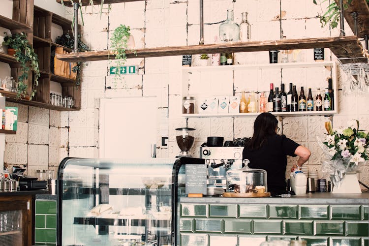 Woman Wearing Black Shirt In A Coffee Shop