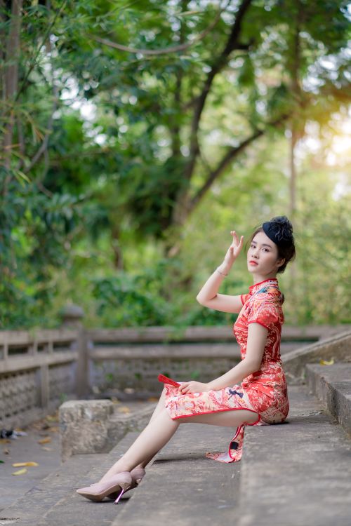 A Woman in Red Dress Sitting on the Stairs · Free Stock Photo