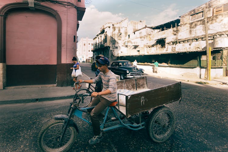 Man On Bicycle With Trailer