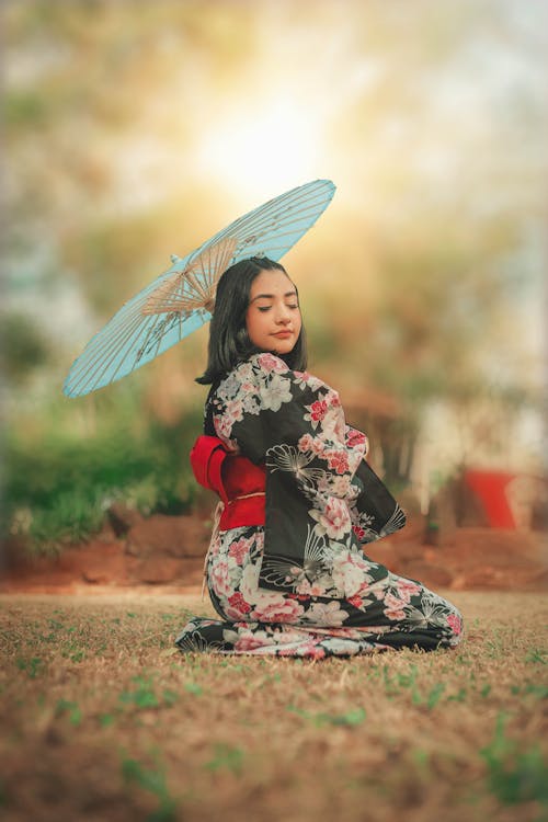 Woman Wearing Kimono Under an Umbrella