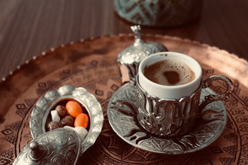 Coffee Served in a Silver Cup 