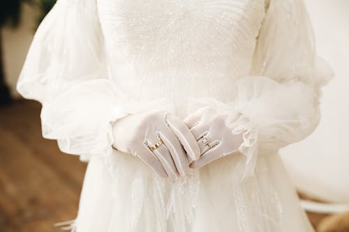 Free Woman in White Wedding Dress Wearing Gold Rings Stock Photo