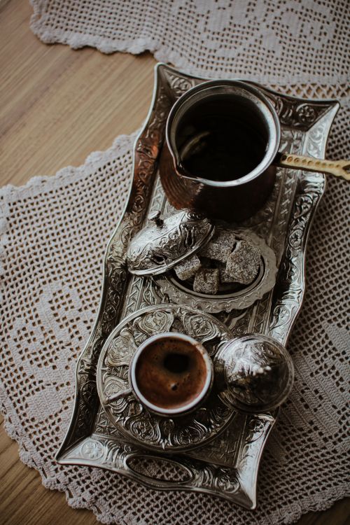 Free Authentic Turkish coffee set on a lace-covered wooden table with ornate metal tray. Stock Photo
