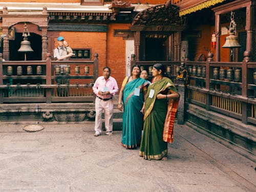 Free Woman wearing Traditional Sari in a Temple  Stock Photo