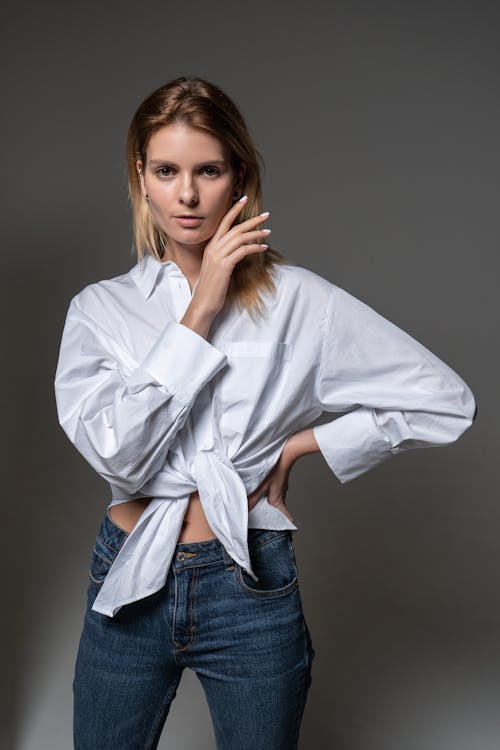 Portrait of a Woman in a Shirt and Jeans 