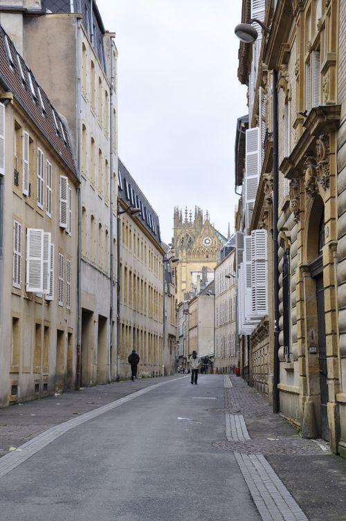 Free Scenic view of a narrow street in Metz, France, leading to the Cathedral of Saint Stephen. Stock Photo