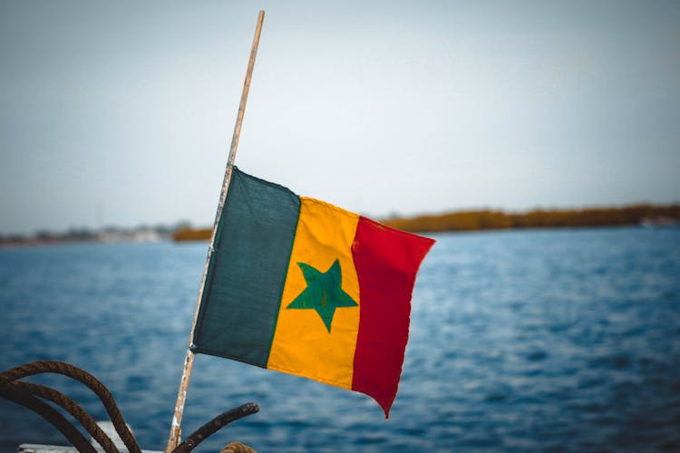 Senegal Flag On The Background Of The Sea 