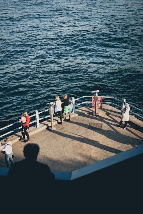 Aerial View of People by the Sea