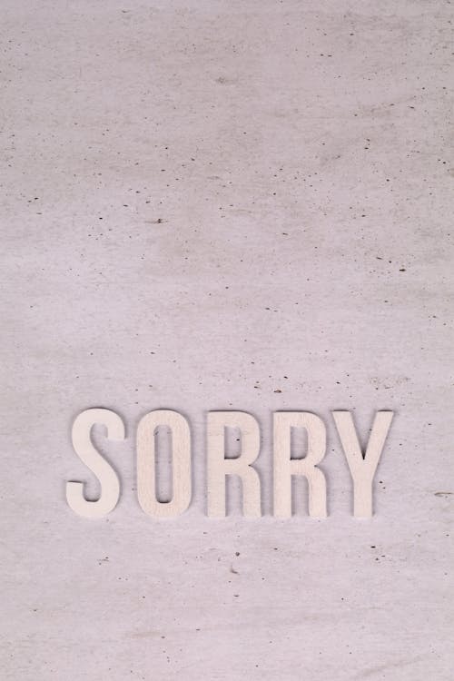 Sorry Text on White Surface 