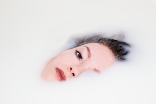 Woman's Face on White Liquid