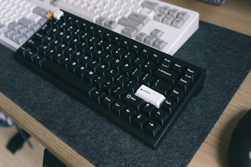 Free Black Computer Keyboard on Black Table Stock Photo