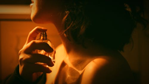 A Woman Using a Perfume