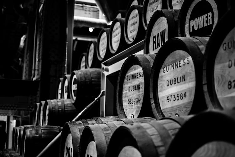 Grayscale Photo Of Beer Barrels